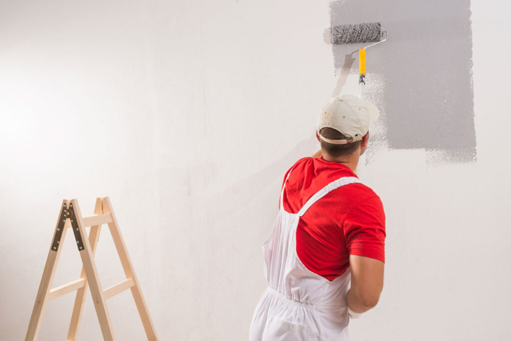 Painter painting a wall