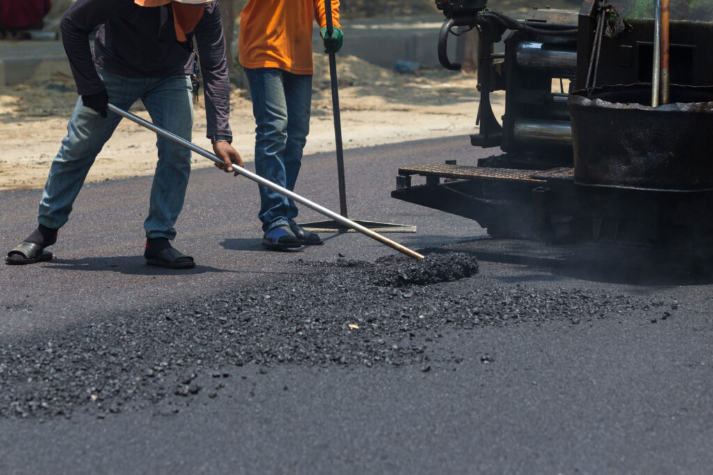 Men paving a road